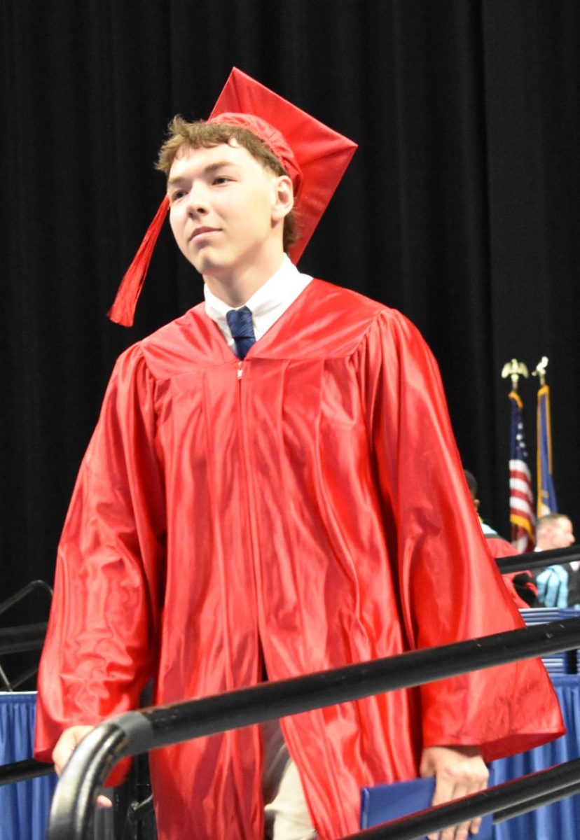LEXINGTON, KY.  A graduate exits the stage with a diploma at Lafayette's graduation ceremonies at Rupp Arena on June 4, 2026.