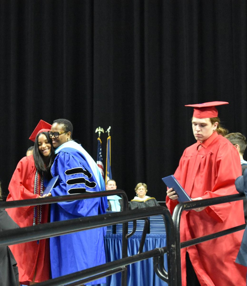 LEXINGTON, KY.  A FCPS staff gives a hug after handing out her student's diploma at the at Lafayette's graduation ceremonies at Rupp Arena on June 4, 2026.