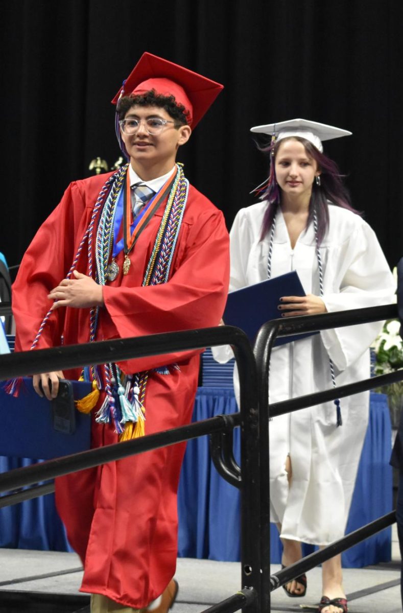 LEXINGTON, KY.  A graduate exits the stage with a diploma at Lafayette's graduation ceremonies at Rupp Arena on June 4, 2026.