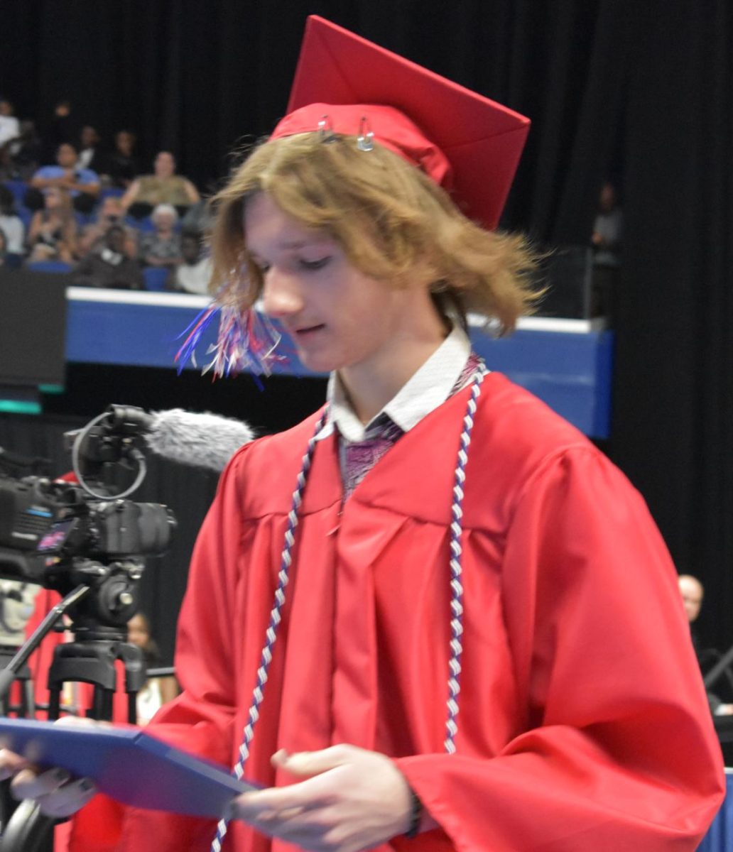 LEXINGTON, KY.  A graduate exits the stage with a diploma at Lafayette's graduation ceremonies at Rupp Arena on June 4, 2026.