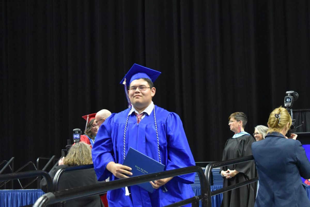 LEXINGTON, KY.  A graduate exits the stage with a diploma at Lafayette's graduation ceremonies at Rupp Arena on June 4, 2026.