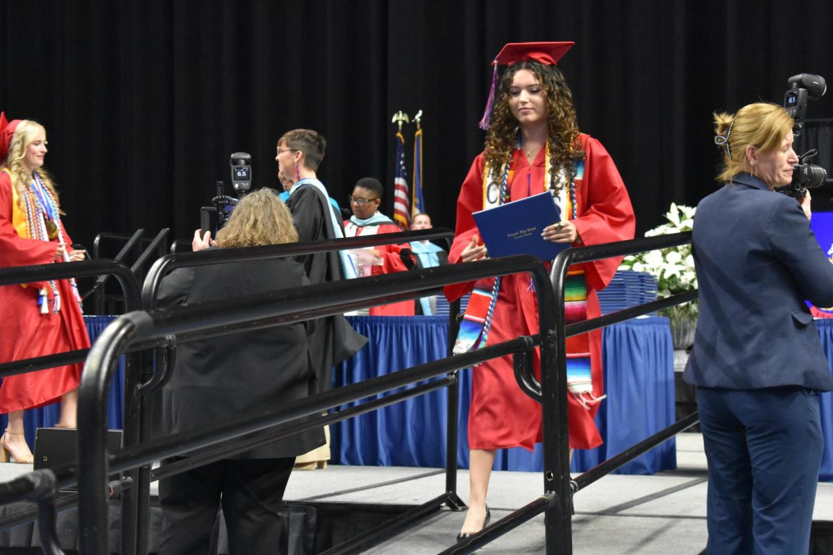 LEXINGTON, KY.  A graduate exits the stage with a diploma at Lafayette's graduation ceremonies at Rupp Arena on June 4, 2026.