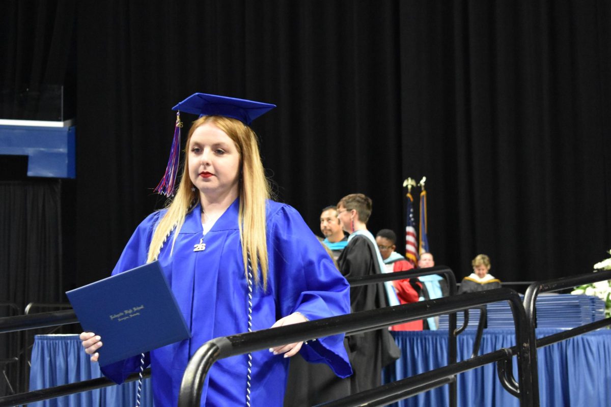 LEXINGTON, KY.  A graduate exits the stage with a diploma at Lafayette's graduation ceremonies at Rupp Arena on June 4, 2026.