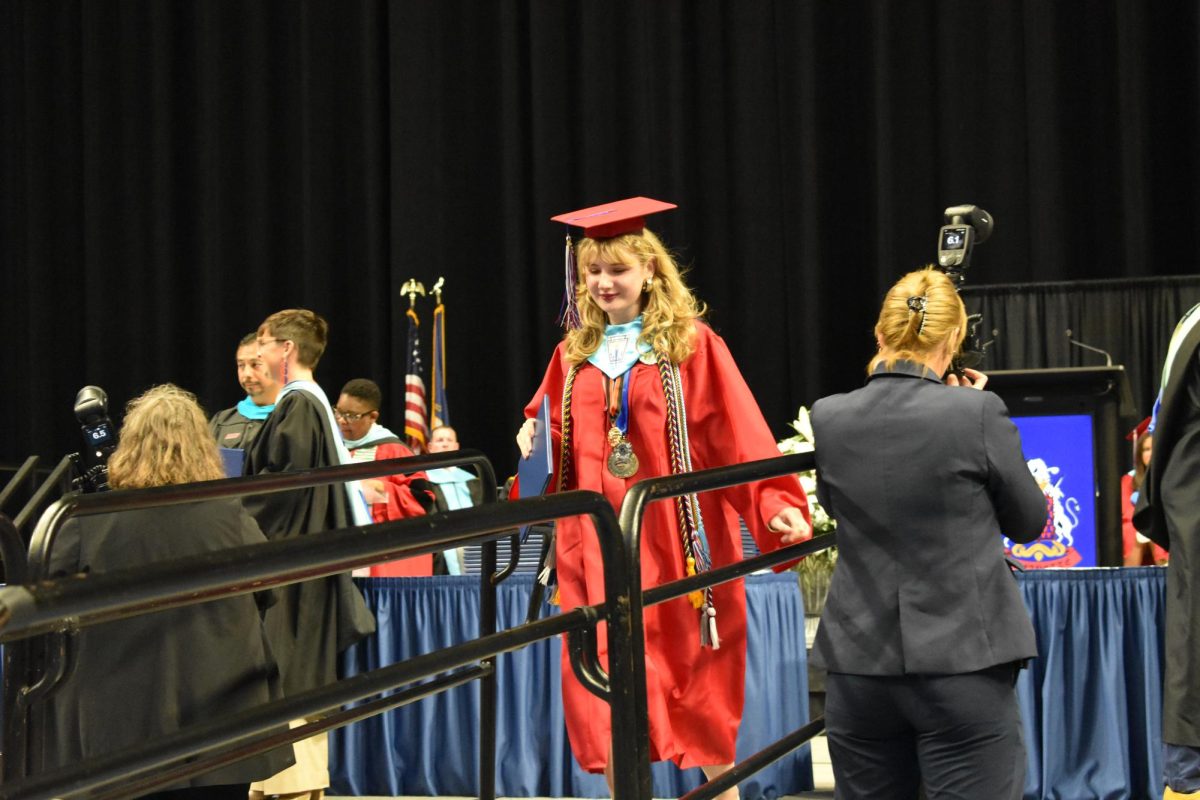LEXINGTON, KY.  A graduate exits the stage with a diploma at Lafayette's graduation ceremonies at Rupp Arena on June 4, 2026.