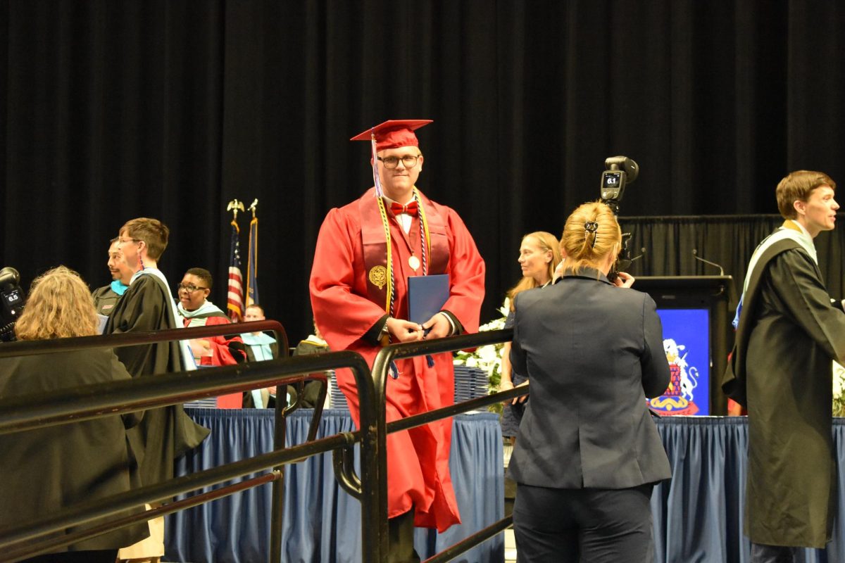 LEXINGTON, KY.  A graduate exits the stage with a diploma at Lafayette's graduation ceremonies at Rupp Arena on June 4, 2026.