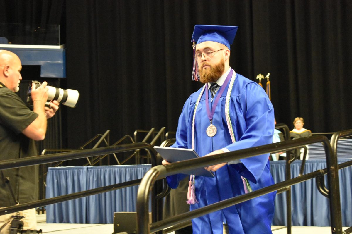 LEXINGTON, KY.  A graduate exits the stage with a diploma at Lafayette's graduation ceremonies at Rupp Arena on June 4, 2026.