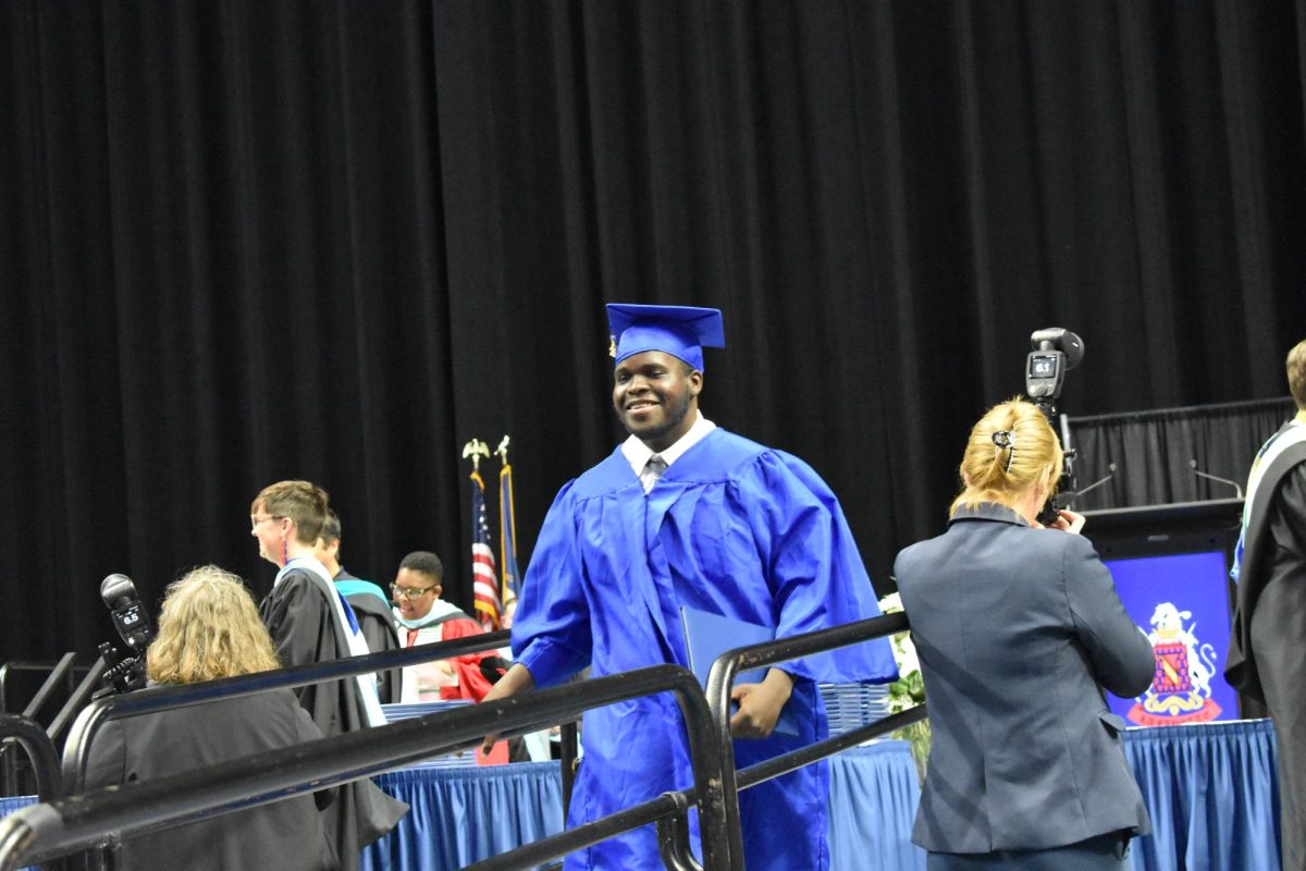 LEXINGTON, KY.  A graduate exits the stage with a diploma at Lafayette's graduation ceremonies at Rupp Arena on June 4, 2026.