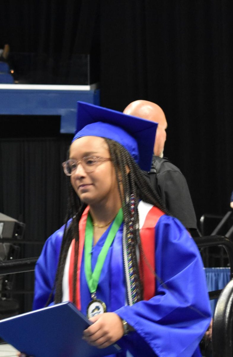 LEXINGTON, KY.  A graduate exits the stage with a diploma at Lafayette's graduation ceremonies at Rupp Arena on June 4, 2026.