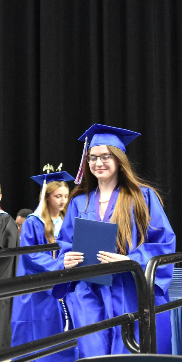 LEXINGTON, KY.  A graduate exits the stage with a diploma at Lafayette's graduation ceremonies at Rupp Arena on June 4, 2026.