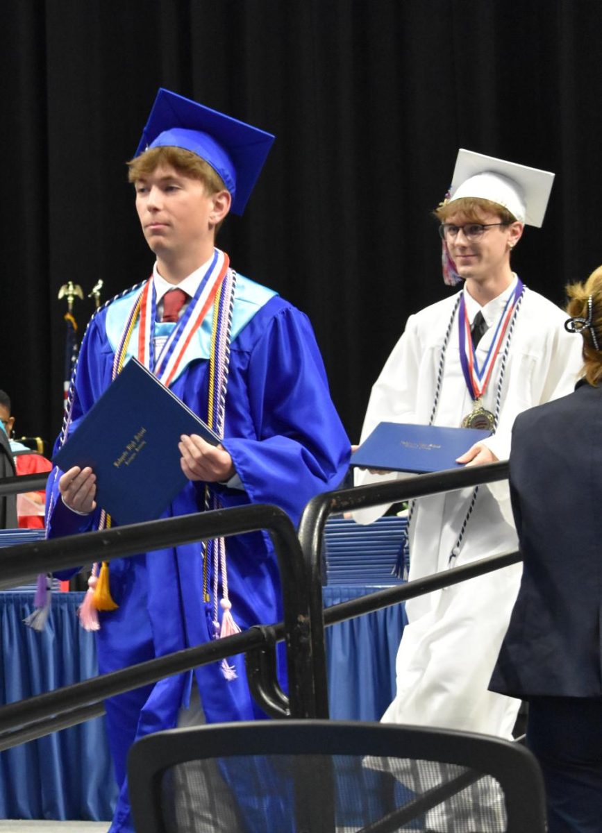 LEXINGTON, KY.  A graduate exits the stage with a diploma at Lafayette's graduation ceremonies at Rupp Arena on June 4, 2026.