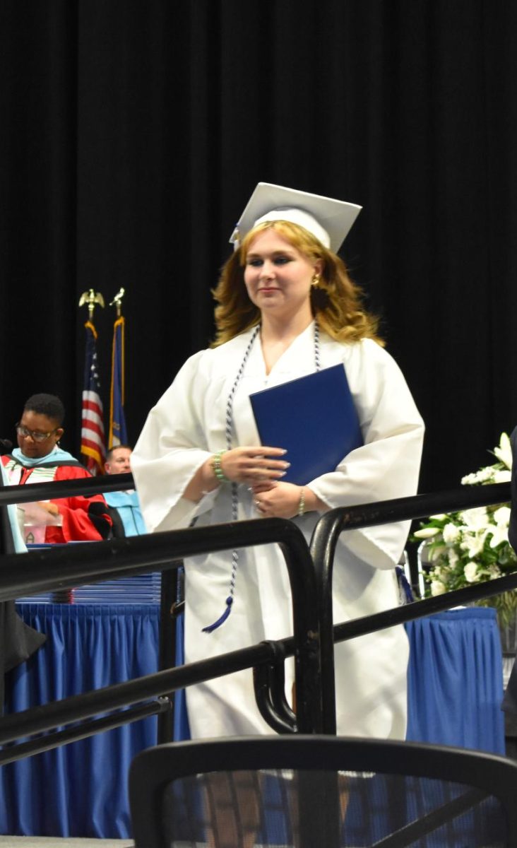 LEXINGTON, KY.  A graduate exits the stage with a diploma at Lafayette's graduation ceremonies at Rupp Arena on June 4, 2026.