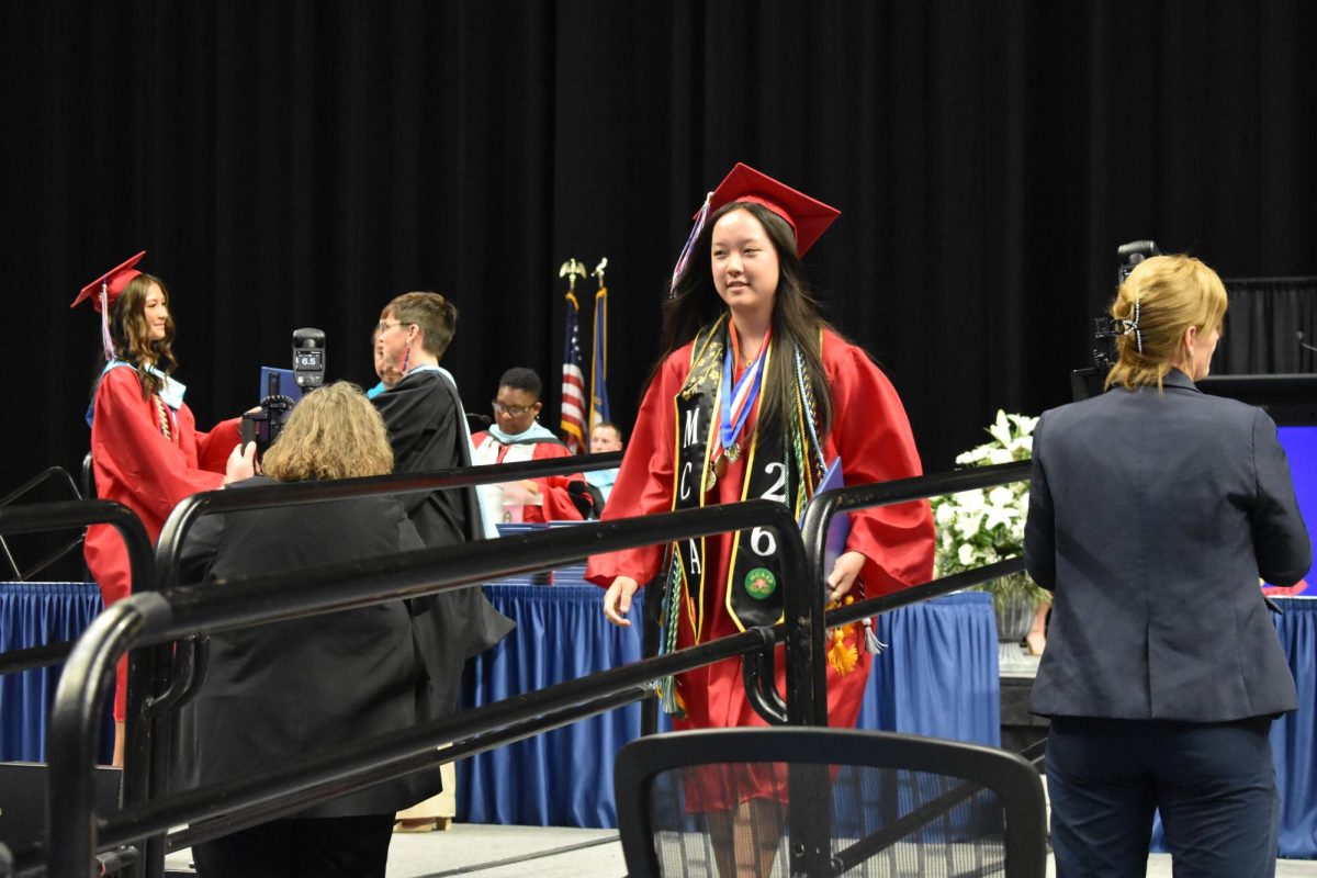 LEXINGTON, KY.  A graduate exits the stage, with diploma, at Lafayette's graduation ceremonies at Rupp Arena on June 4, 2026.